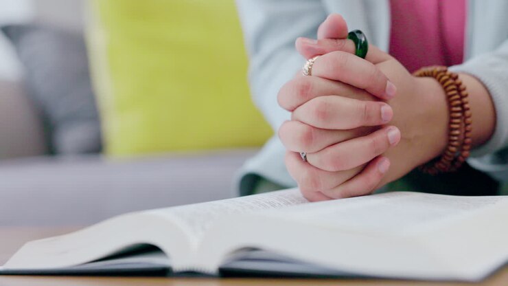 Woman hands, bible and christian prayer in home