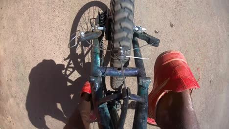 ethiopian cyclist start paddling in long runway top view tire and wheel