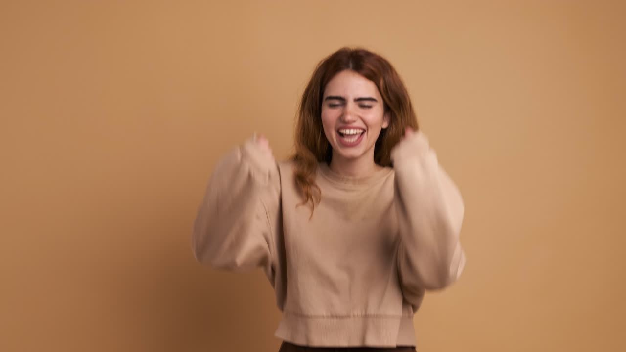 A young caucasian woman shouting in despair