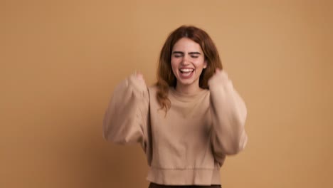 a young caucasian woman shouting in despair