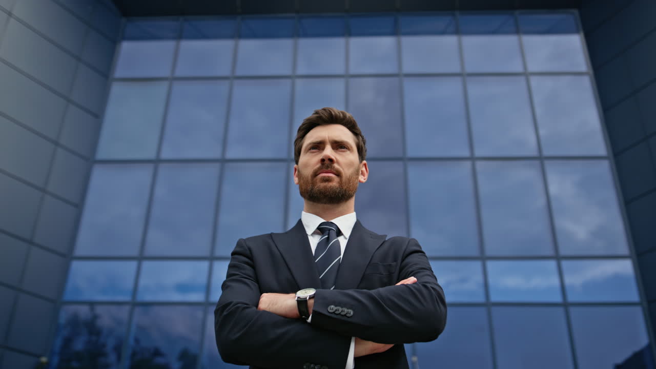 Confident Businessman in Front of Modern Office Building