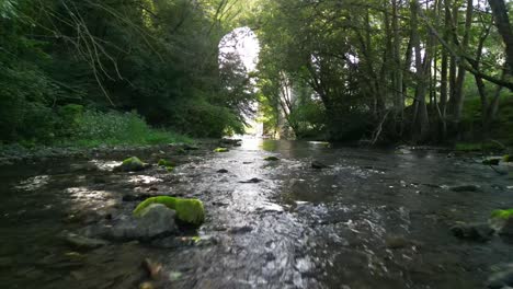 Babbling-Brook-drone-low-fly-over-in-slo-mo---Chirk-Aqueduct-background,-River-Ceiriog,-Chirk,-Wales-UK---hazy-summer-afternoon---Sept-23