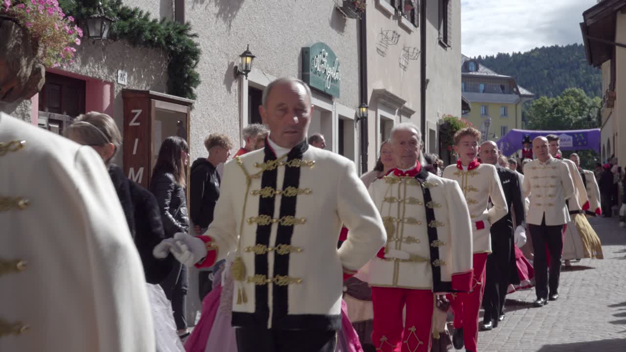 People in Historical Costumes Marching in a Parade