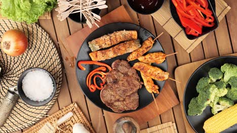 top-down-shoot-of-a-steak-lying-on-a-wooden-board-surrounded-by-ingredients