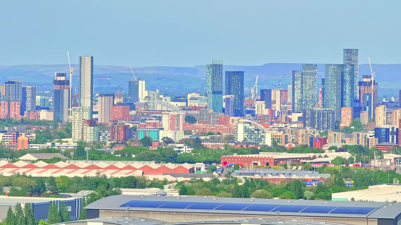 Pan drone shot of downtown near Trafford Centre large indoor shopping centre and entertainment complex in Trafford Park, Greater Manchester, England