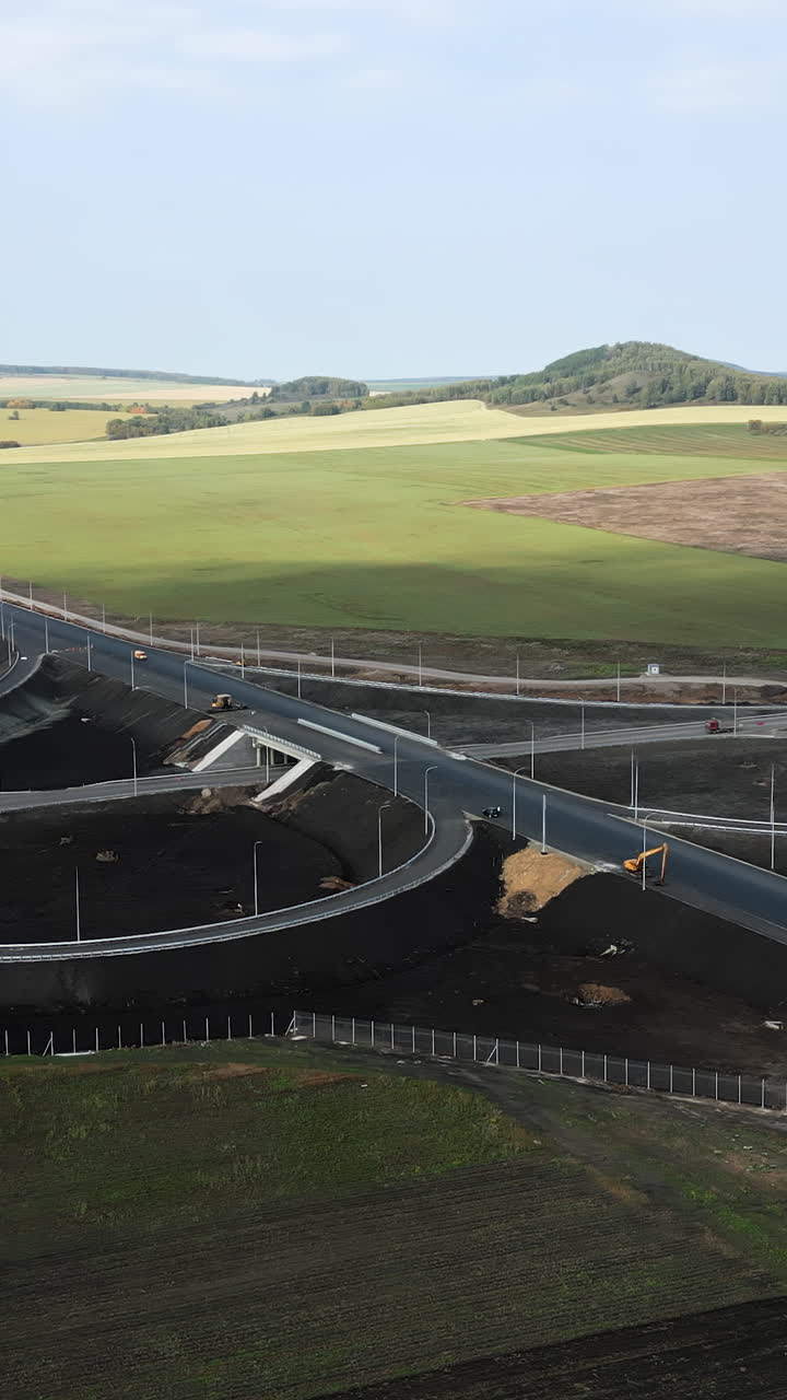 Aerial view of a highway interchange in a rural landscape