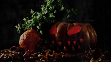 Halloween-carved-scary-pumpkin-lamp-against-grunge-textured-effect-on-black-background