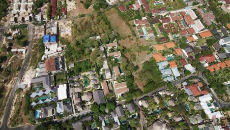 Drone-shot-of-Bali-Real-Estate-Development-luxury-villas,-resorts-with-swimming-pool-located-in-Bingin,-Badung,-Bukit