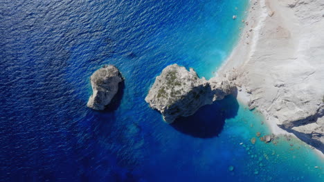 aerial: top down shot of myzithres beach in keri of zakynthos island, greece