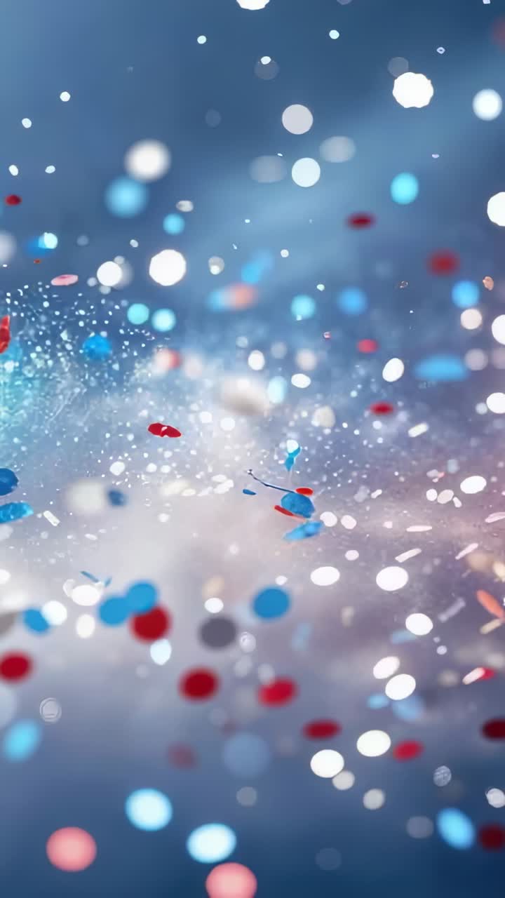 Vertical video: Opening on blue field confetti-like particles drifting with orbs, spark speckles