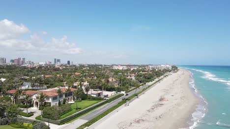 an-aerial-journey-down-a-beautiful-coastline-road-in-West-Palm-Beach,-Florida