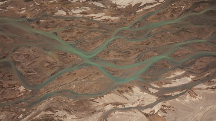 Top-down aerial view of river estuary in Landmannalaugar, creating abstract patterns. Part 1.