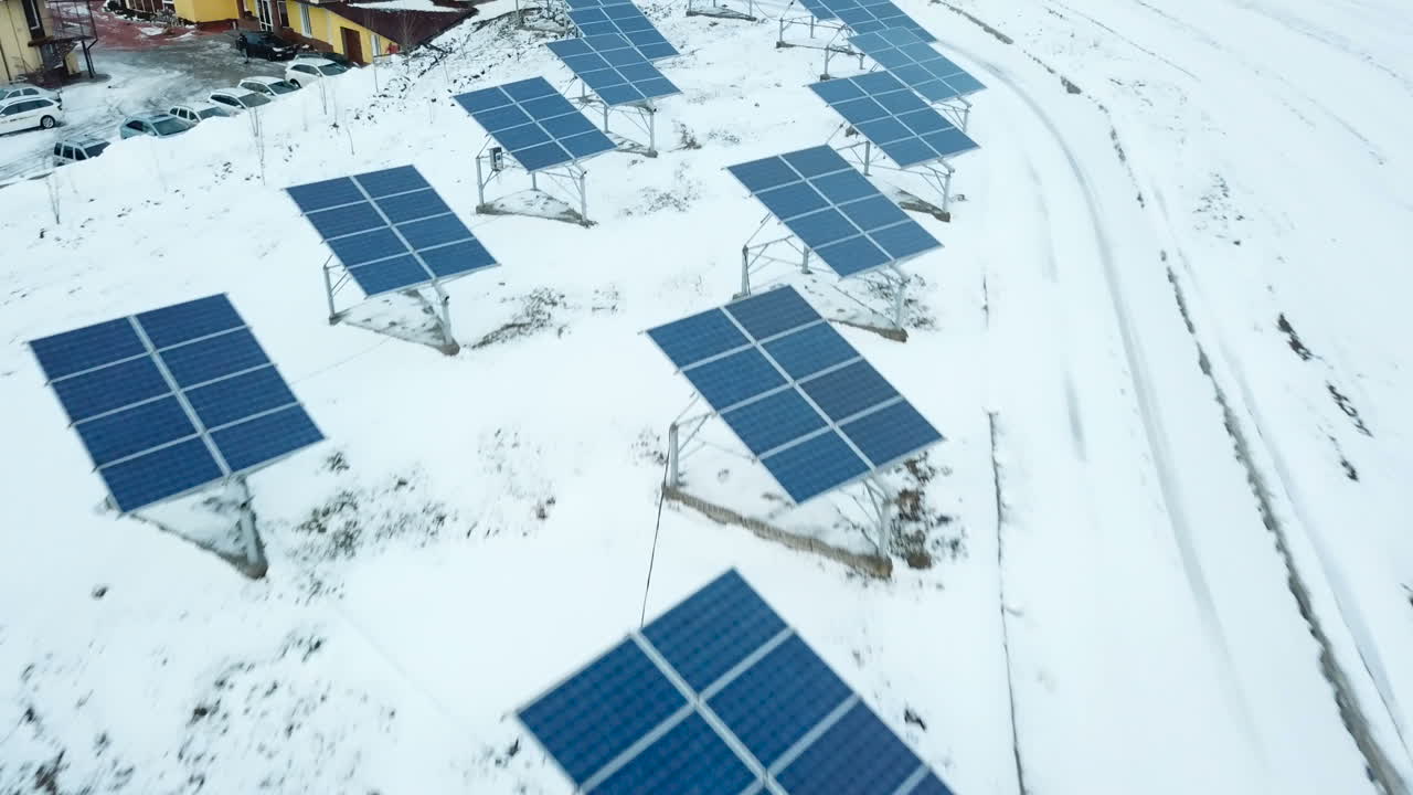 Alternative energy solar power plant in the winter. Solar power plant on the outskirts of the city.