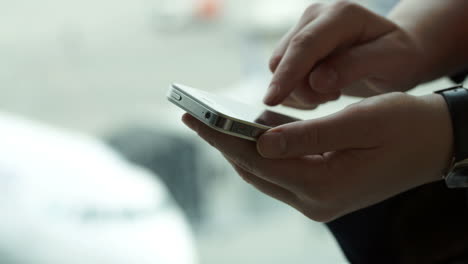 Close-up-shot-of-female-hands-typing-sms-on-smartphone