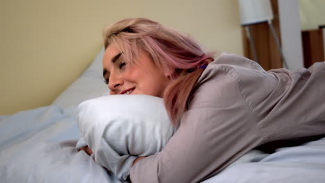 pretty young blonde flopping down on her bed