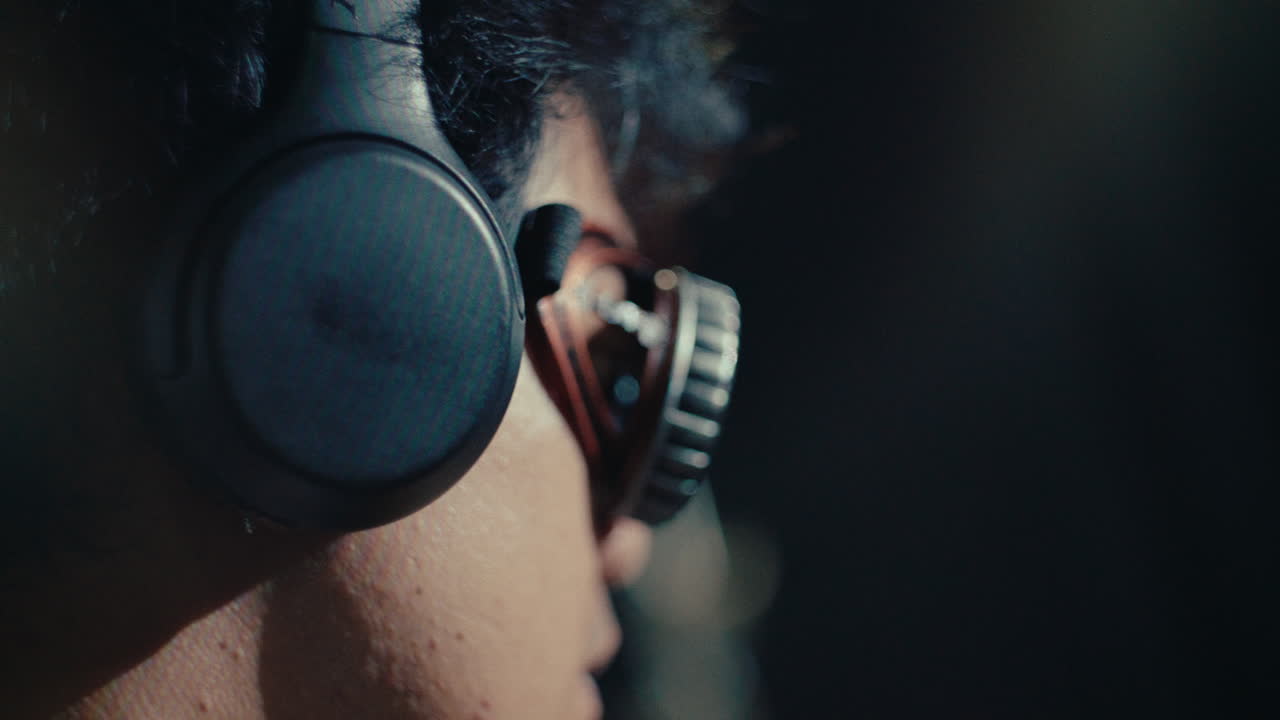 music dj alternative male young musician dancing and playing at party in nightclub