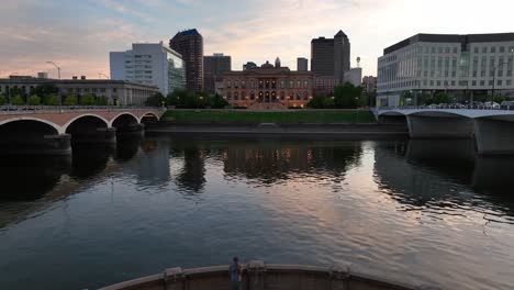 aerial flight through simon estes amphitheater on des moines riverfront during sunset