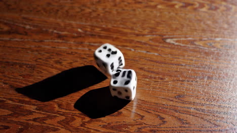 two dice on a wooden table