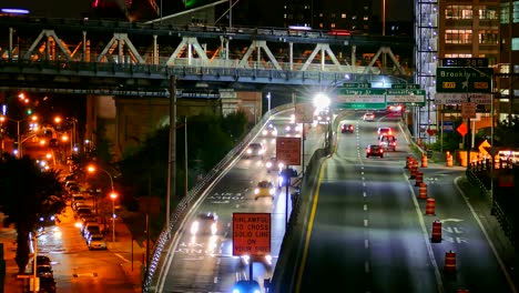 night traffic on a city highway with a bridge