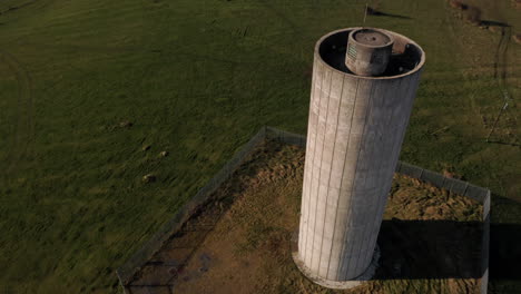 dynamic aerial orbit around the clarinbridge water tower, showcasing its unique architectural features and design. galway