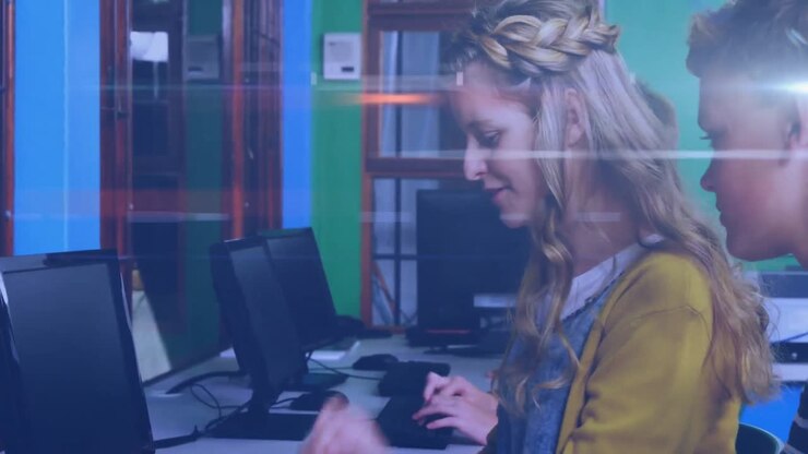 Animation of light over caucasian teenager students using computers