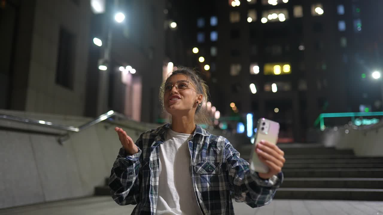 Young Woman Making a Video Call at Night