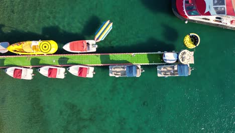 a drone fotage of a boat docking at a tropical marina