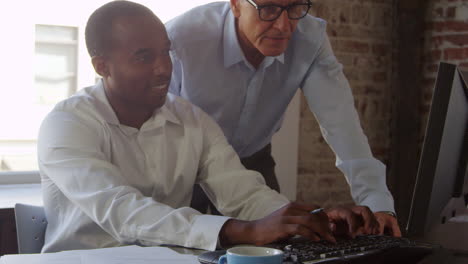 Trainee-And-Businessman-Work-On-Computer-Shot-On-R3D