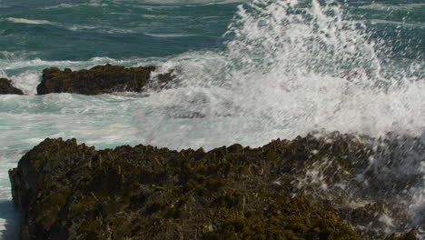 sea waves crashing on ocean rocks tidal pool