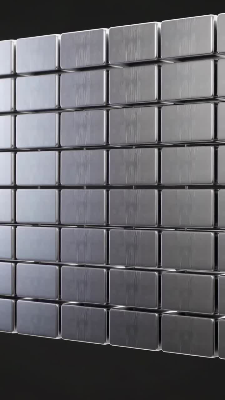 Video verticale: spostamento della telecamera per rivelare una griglia di piastrelle metalliche in studio, in modo da mostrare riflessi delicati