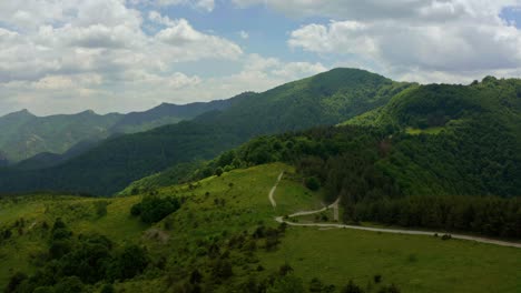 cinematic drone flight over green idyllic mountains of rhopdope during cloudy day in bulgaria