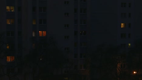 a residential concrete building at night in eastern berlin, germany