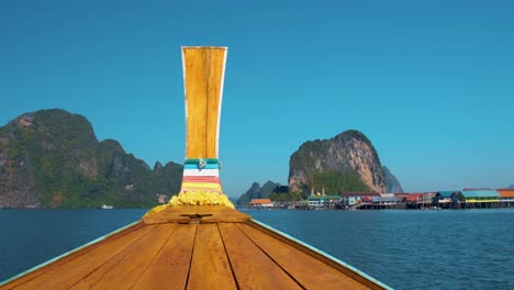 koh panyee, long tail boat at ko panyi or koh panyee, muslim fisherman village landmark attractions travel by boat at ao phang nga bay national park, thailand. south east asia