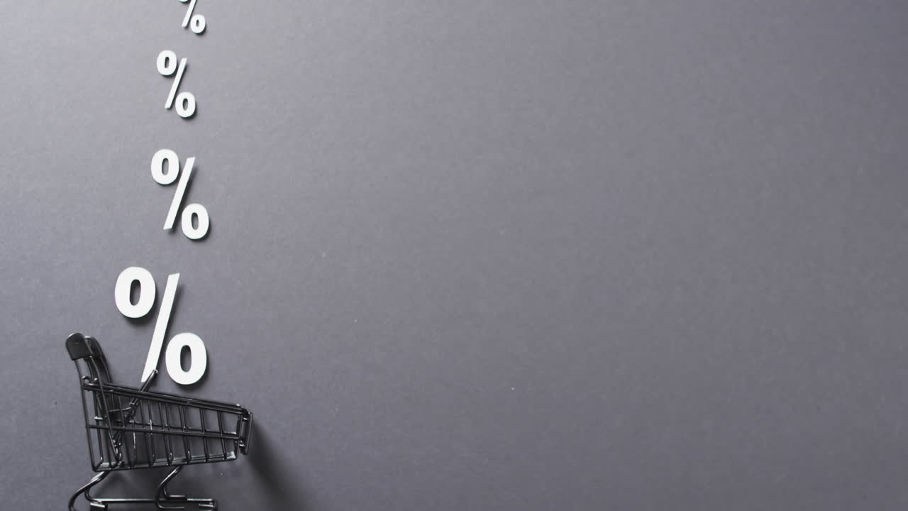 video de un carrito de compras y señales de porcentaje blanco sobre un fondo gris