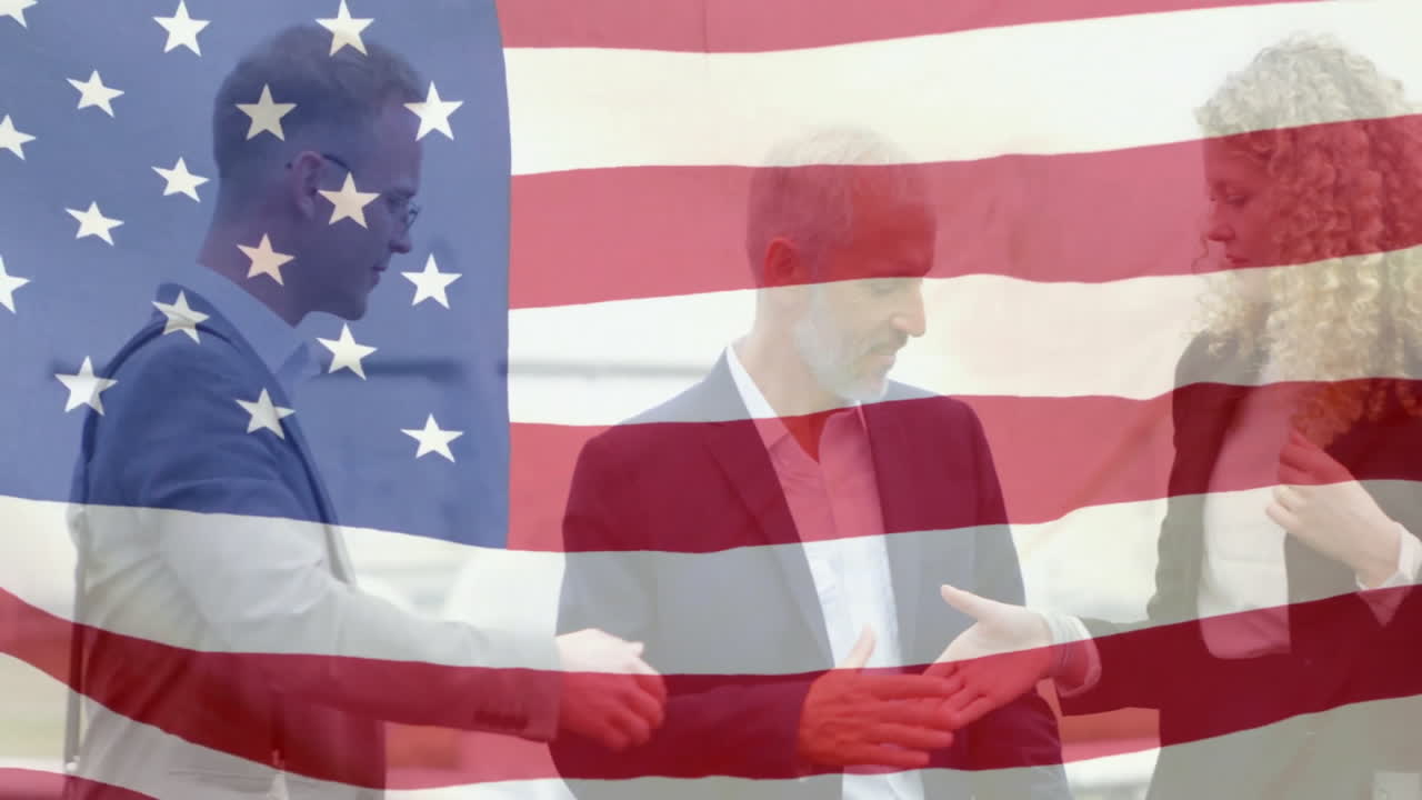 Shaking hands, business people with American flag animation overlay in background