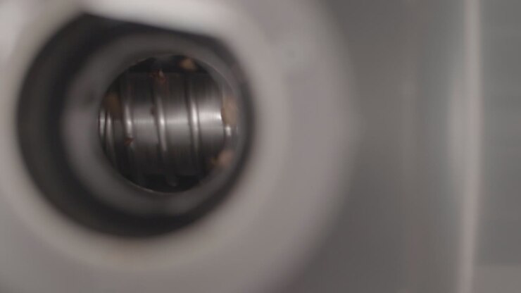 Close up of coffee beans being grinded