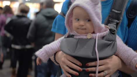 cute baby in a baby carrier