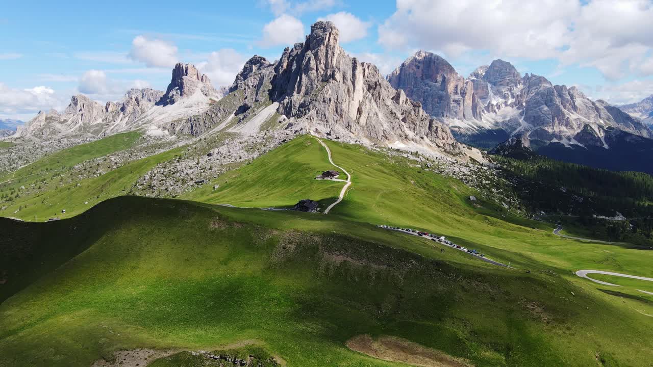 Breathtaking drone of Passo Giau, Dolomites, lush green valleys and rocky peaks