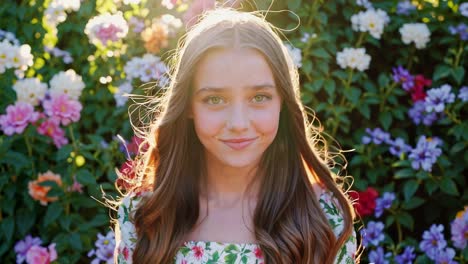 teenage girl clapping happily in a garden