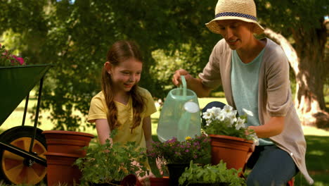 Mother and daughter gardening together 
