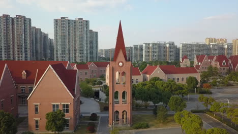 drone pilot flies camera to clock tower in suzhou city park, china