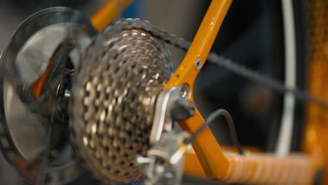 rotating bicycle chain and gears to test bicycle. cycling workshop, close up