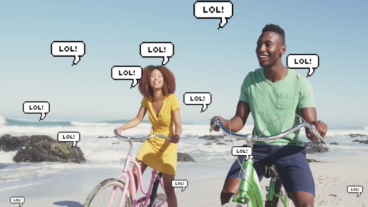Animation of speech bubbles with lol text over happy couple riding bikes on beach