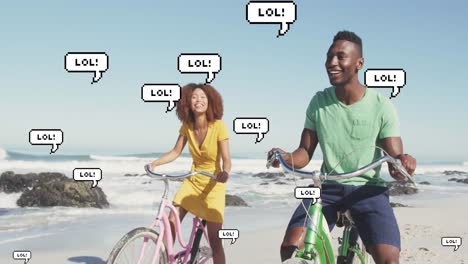 animation of speech bubbles with lol text over happy couple riding bikes on beach