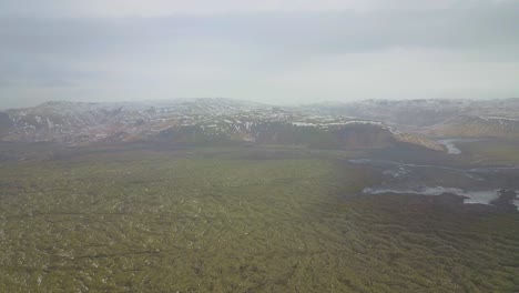 aerial shot high up in the sky overlooking icelandic mountains and rivers