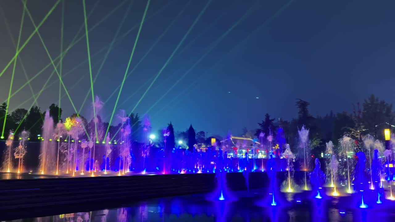 A Dazzling Light Display Perfectly Synchronized With a Musical Fountain at the Giant Wild Goose Pagoda in Xi'an, China - Pan Right Shot