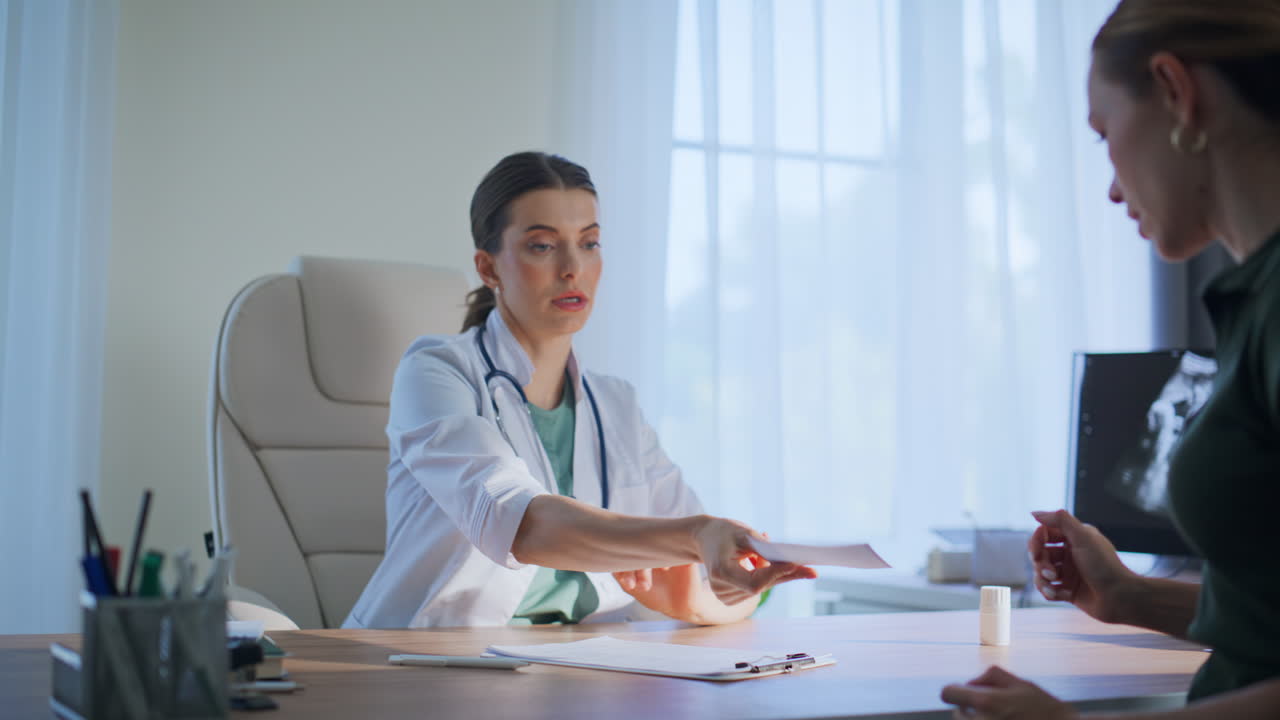 Doctor providing medical advice to clinic patient. Therapist discuss treatment