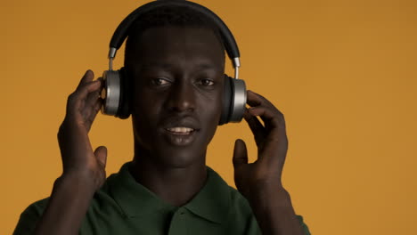 african american man on yellow background.