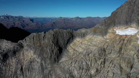slow-drone-shot-Milford-Sound-Gertrude-Saddle-Fiordland-National-Park,-New-Zealand