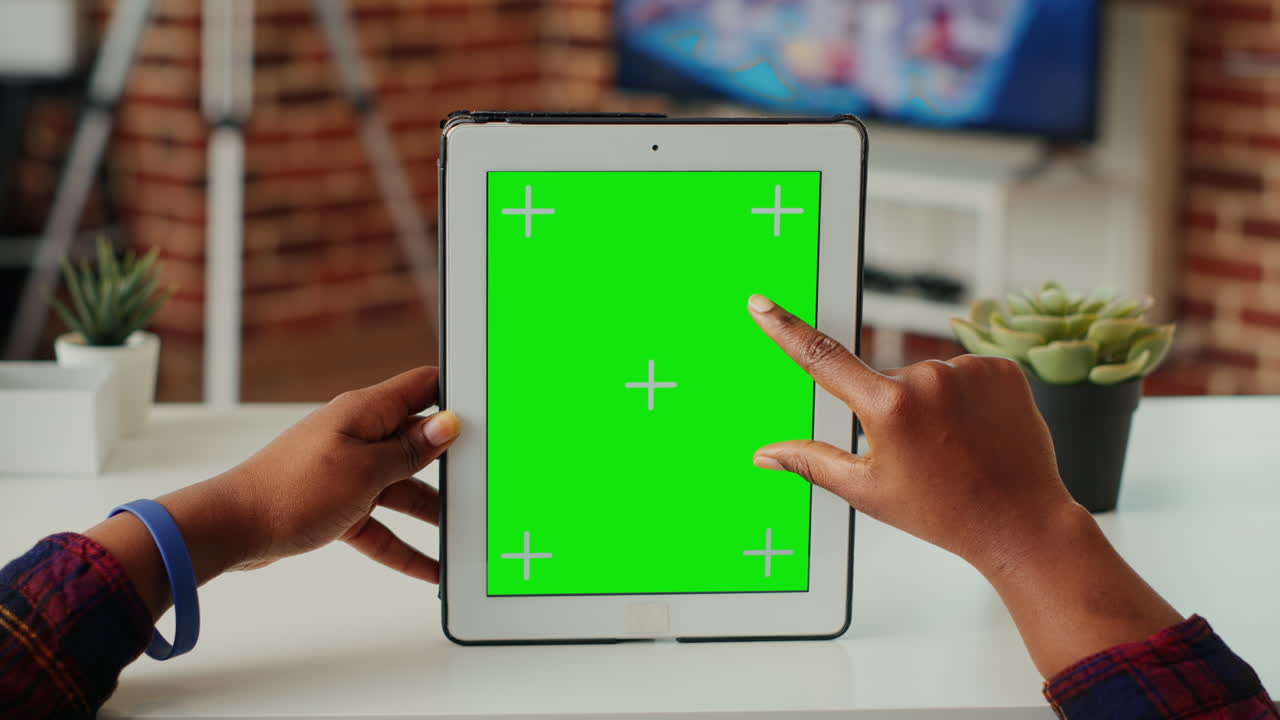 Woman analyzing greenscreen on isolated display